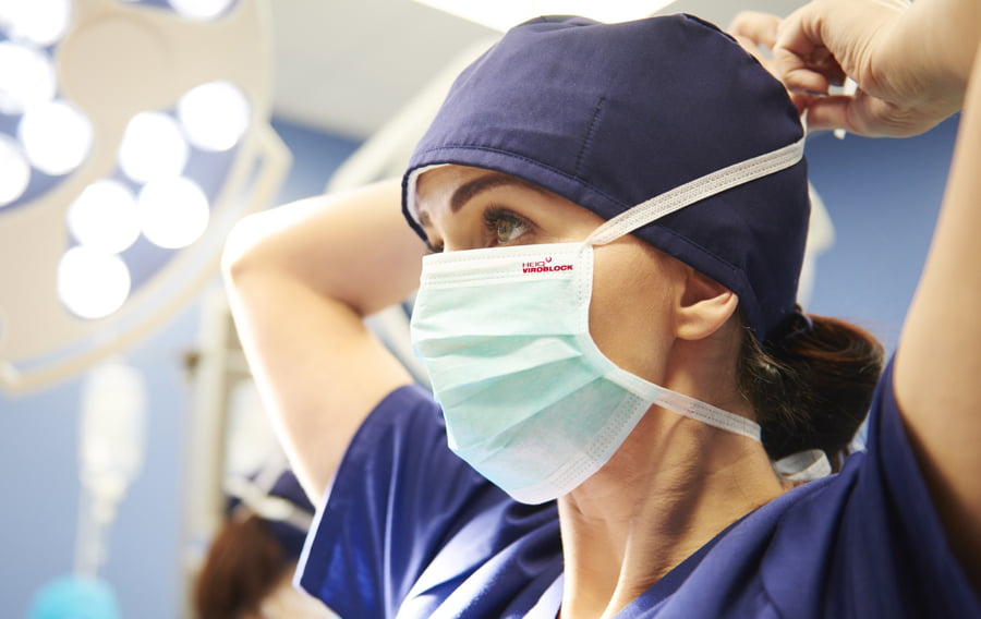 Nurse using face mask treated with Viroblock anti-viral treatment